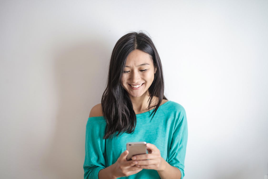 Free Photo of Woman Using Mobile Phone Stock Photo
