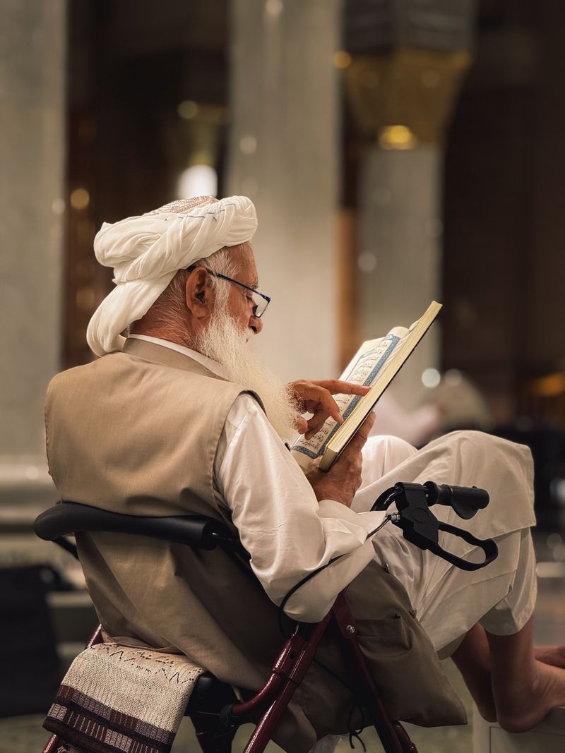 Man reciting the Quran in a mosque — Tajweed and Tafseer
