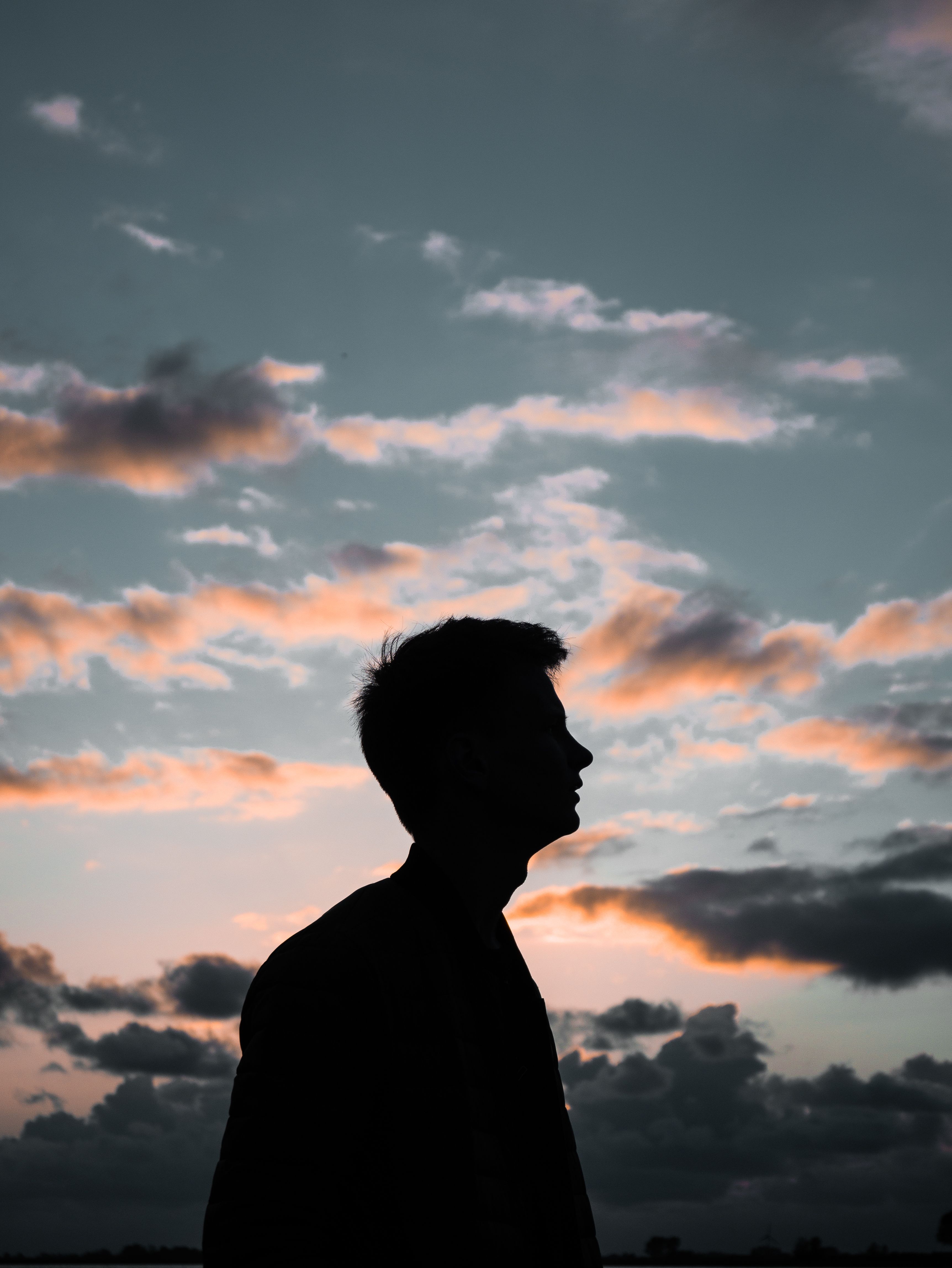 Silhouette of a Man Looking at the Sky · Free Stock Photo