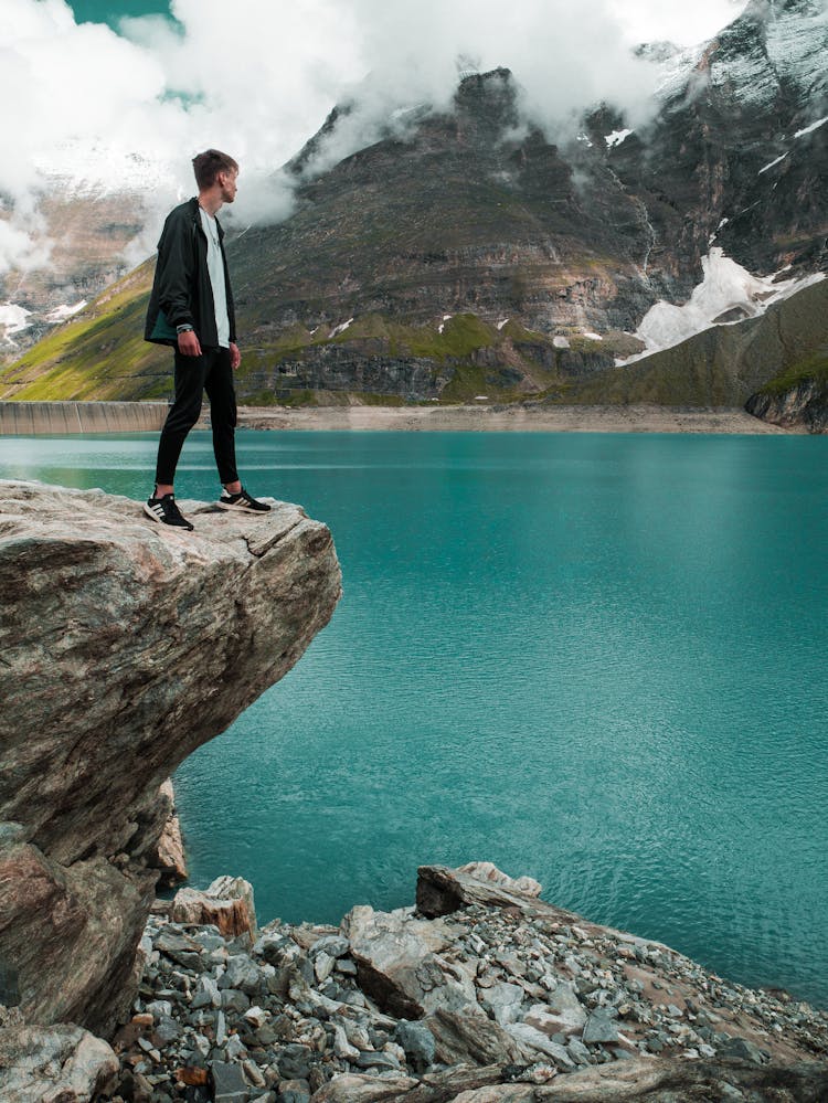 Man In Black Pants Standing On Cliff 