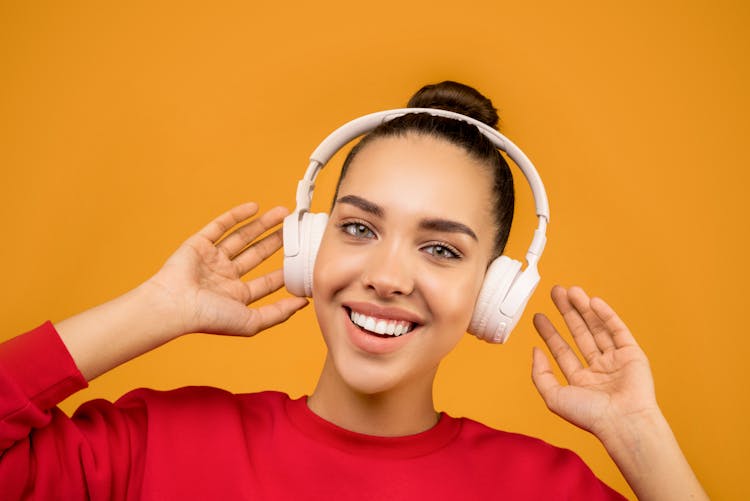 Photo Of Woman Wearing White Headphones