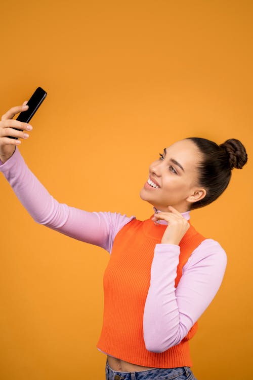 Photo of Woman Holding Mobile Phone