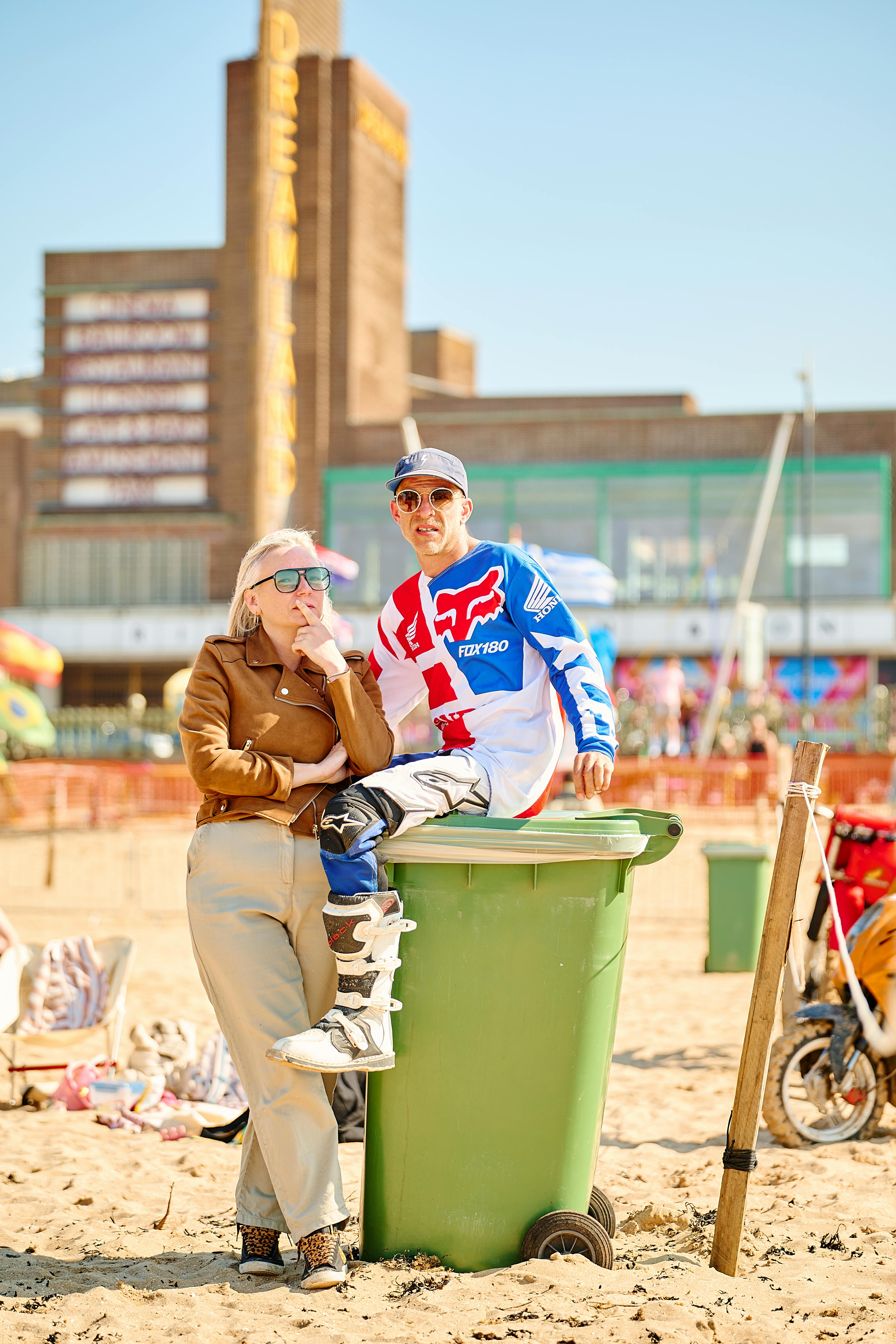 Two motorcycle enthusiasts enjoy the sunny beach surroundings in Margate, England.