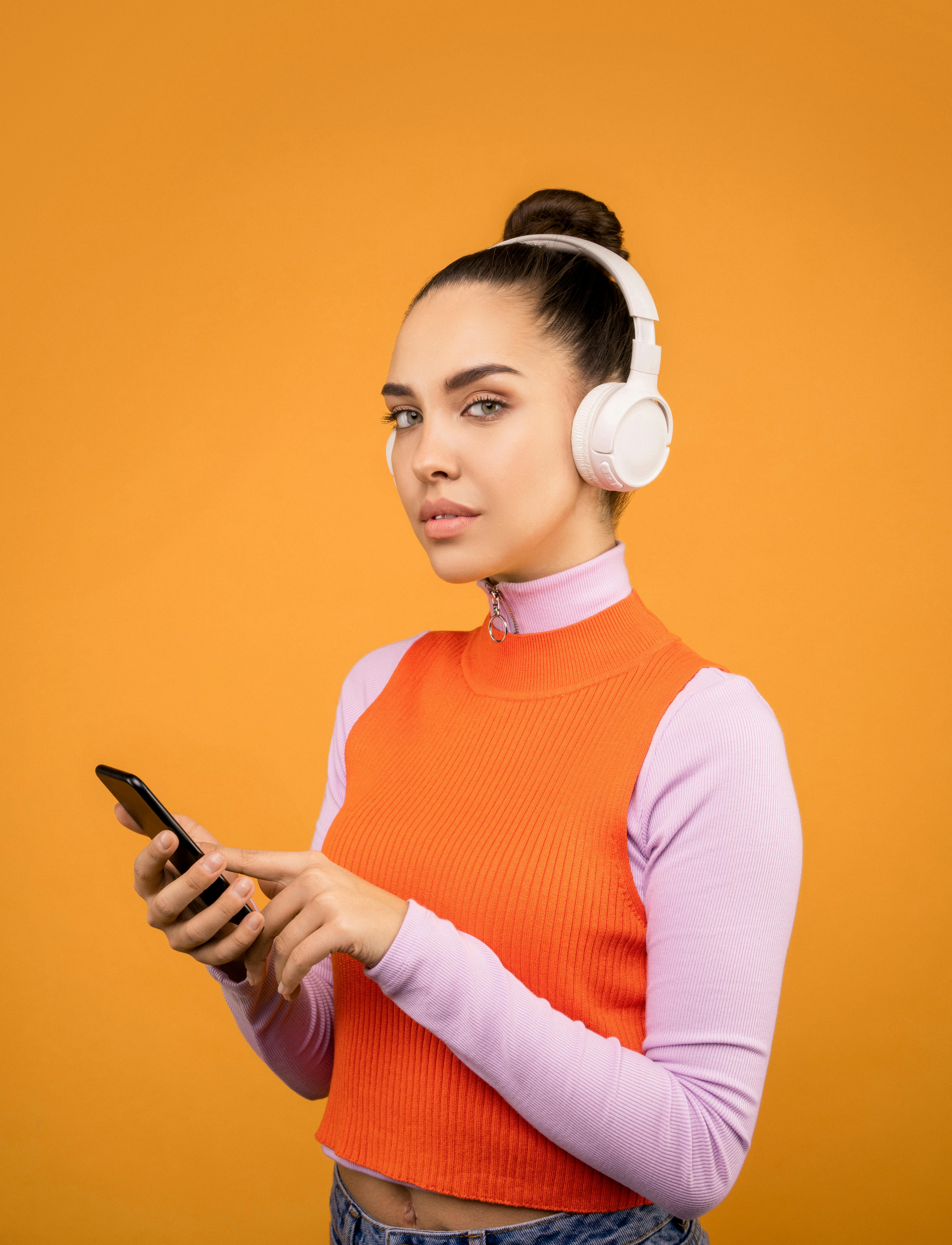 photo of woman listening to music