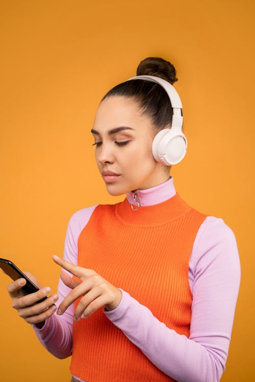 Free Photo of Woman Wearing White Headphones Stock Photo