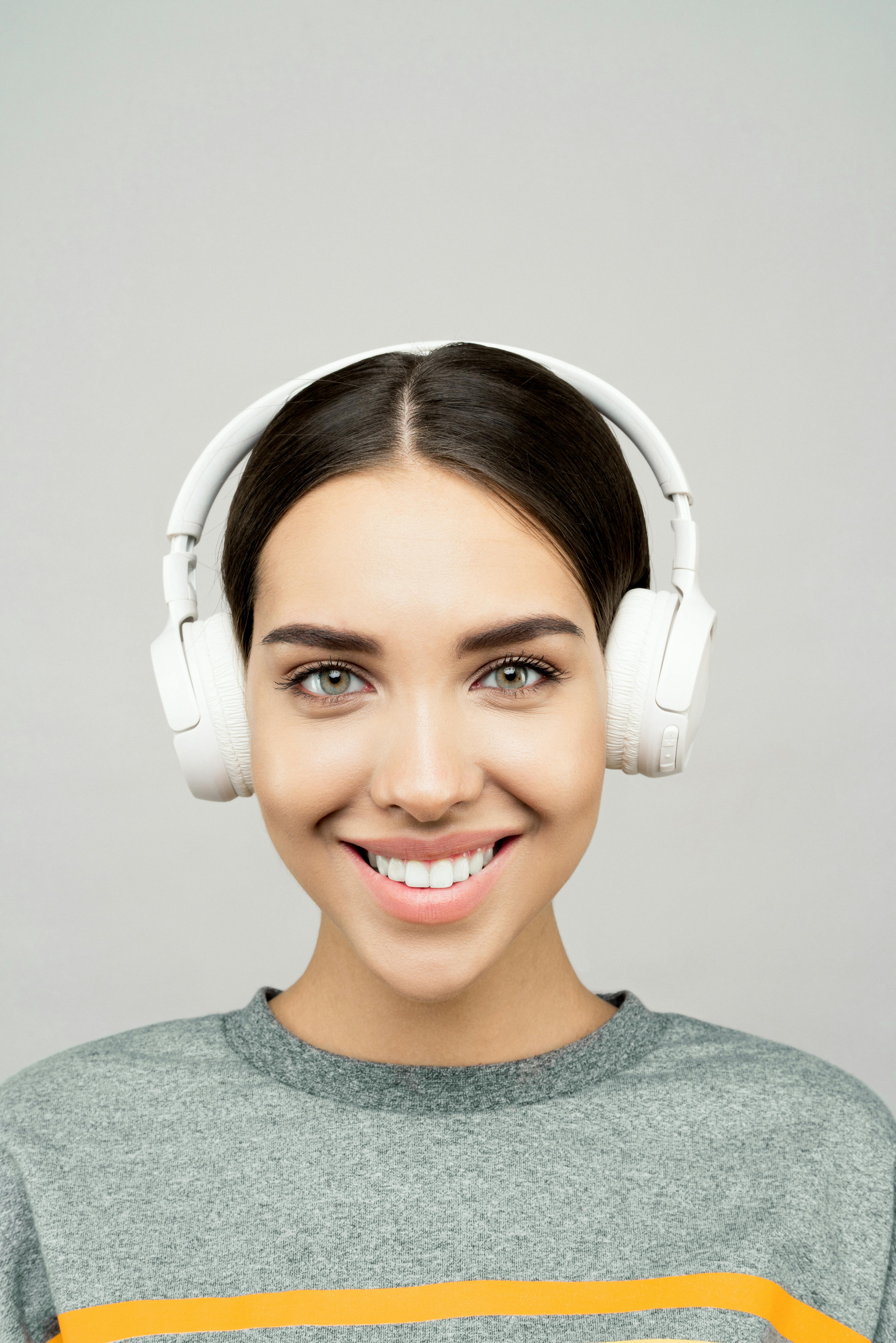 A squad of soldiers in futuristic armor walking through a dark, smoky battlefield.