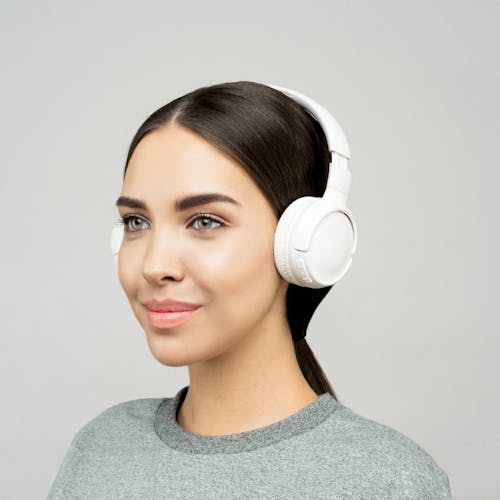 Free Photo of Woman Wearing White Headphones Stock Photo