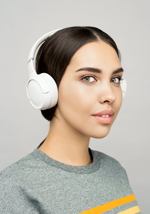 Photo of Woman Wearing White Headphones
