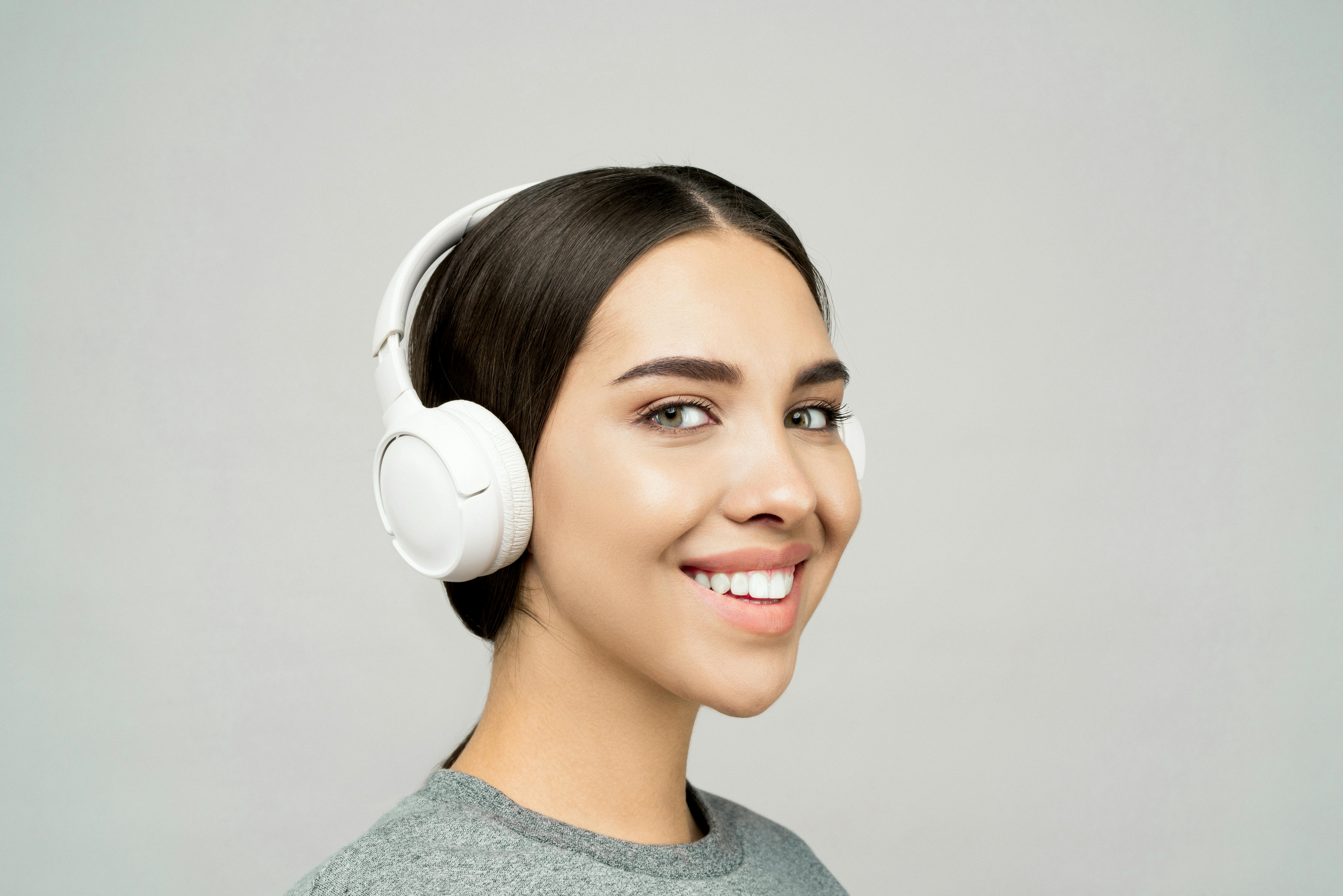 lovely lady wearing a white headphones