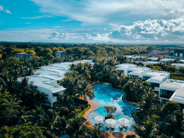 Luxury resort with tropical pool aerial view