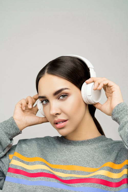 Photo of Woman Wearing White Headphones