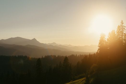 A breathtaking sunset over the Tatra Mountains in Zakopane, Poland, highlighting serene natural beauty.