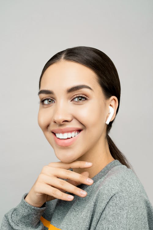 Photo of Woman In Gray Sweater