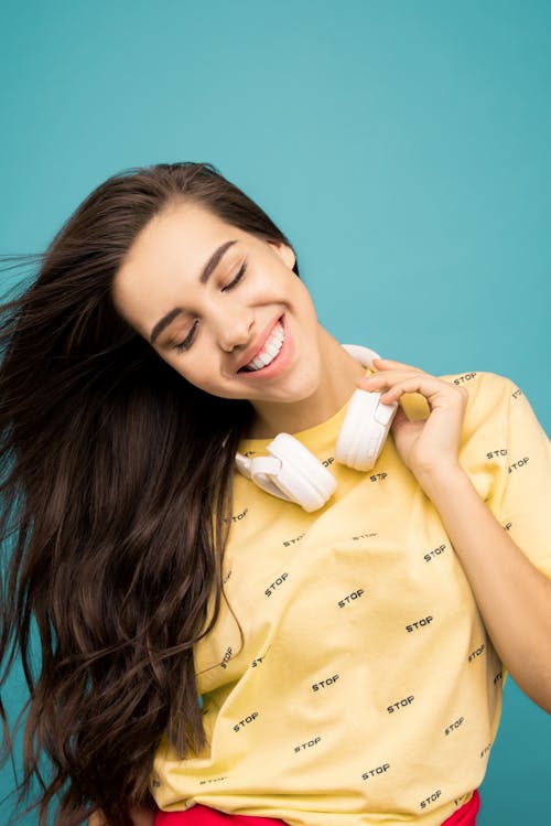 Free Photo Of Woman Touching Hey Headphones Stock Photo