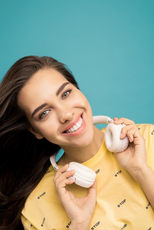Portrait Photo Of Woman Holding Her Headphones