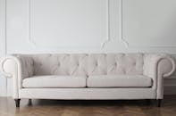 Photo Of White Couch On Wooden Floor
