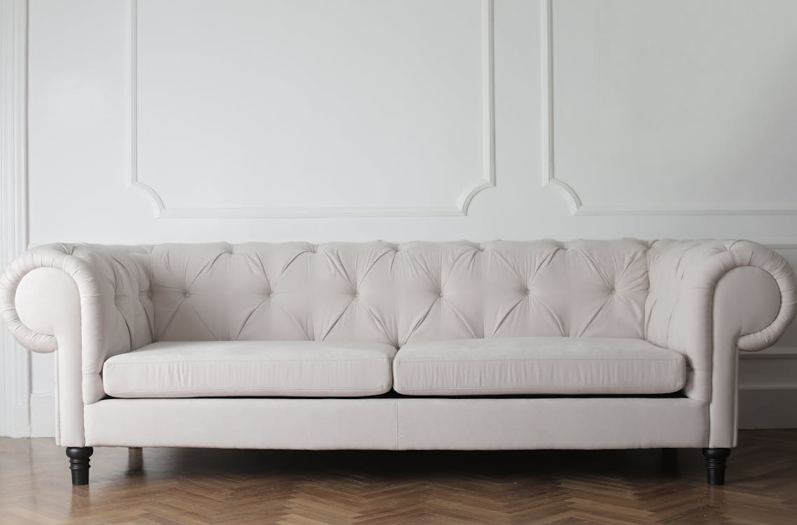 Free Photo Of White Couch On Wooden Floor Stock Photo