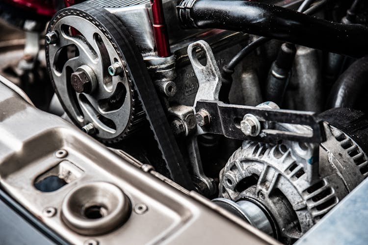 Close-up Photo Of Black And Silver Car Engine