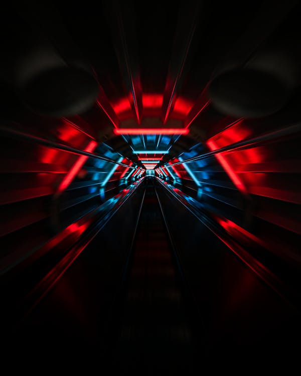 Free Dark urban tunnel with red and blue neon lights Stock Photo