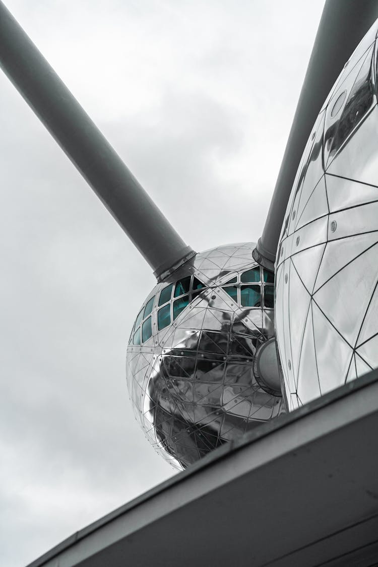 Modern Futuristic Sphere Shaped Building Against Gray Sky