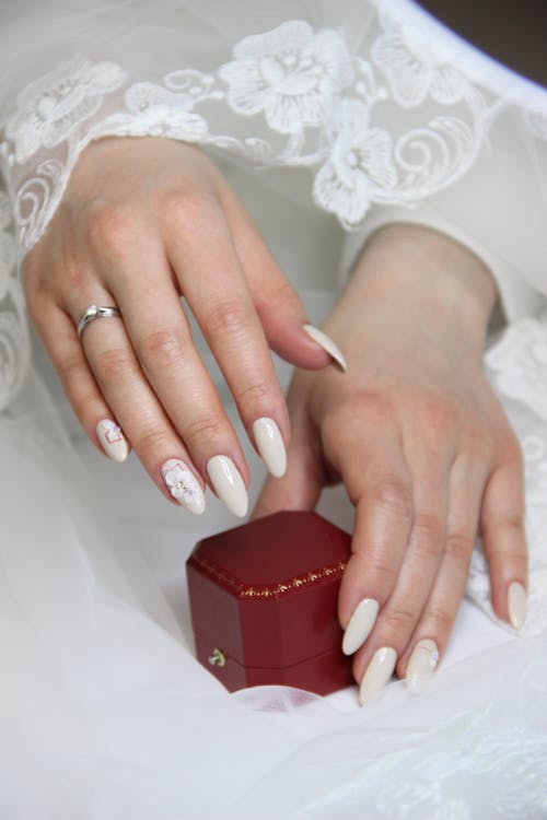 Free Woman Wearing Ring Holding Red Box Stock Photo