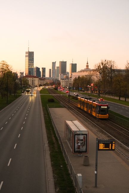 Street view of tram and skyscrapers in twilight Warsaw, Poland.