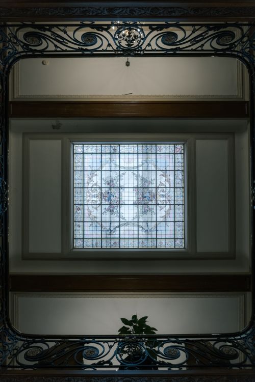 Free Elegant interior featuring stained glass and decorative ironwork in Rosario, Argentina. Stock Photo