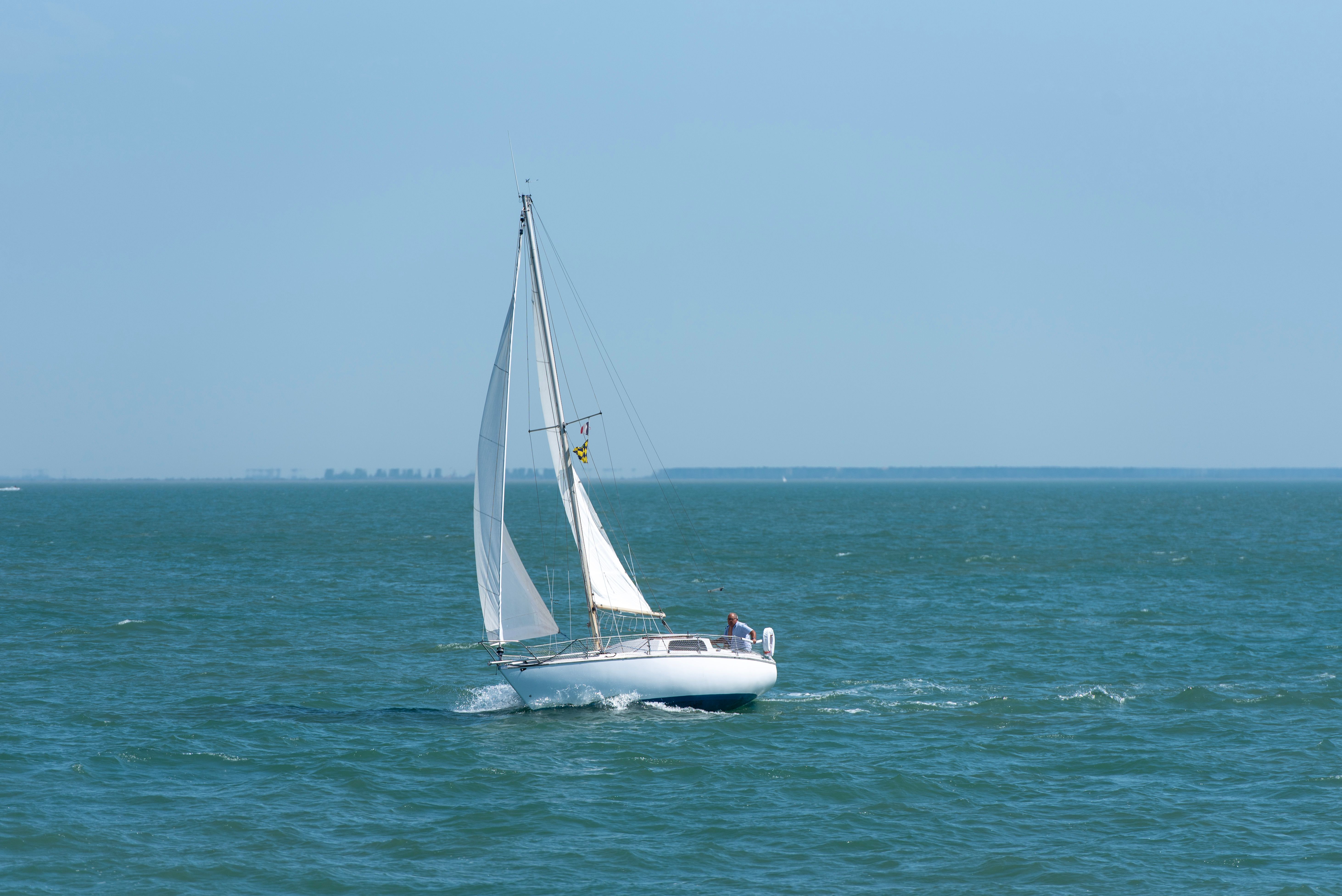 Unbeatable Private Deep Sea Fishing Charter in Honolulu Review: The Ultimate Oahu Sportfishing Adventure Review 2026 - Elegant yacht sailing smoothly on a clear blue ocean under a bright sky.