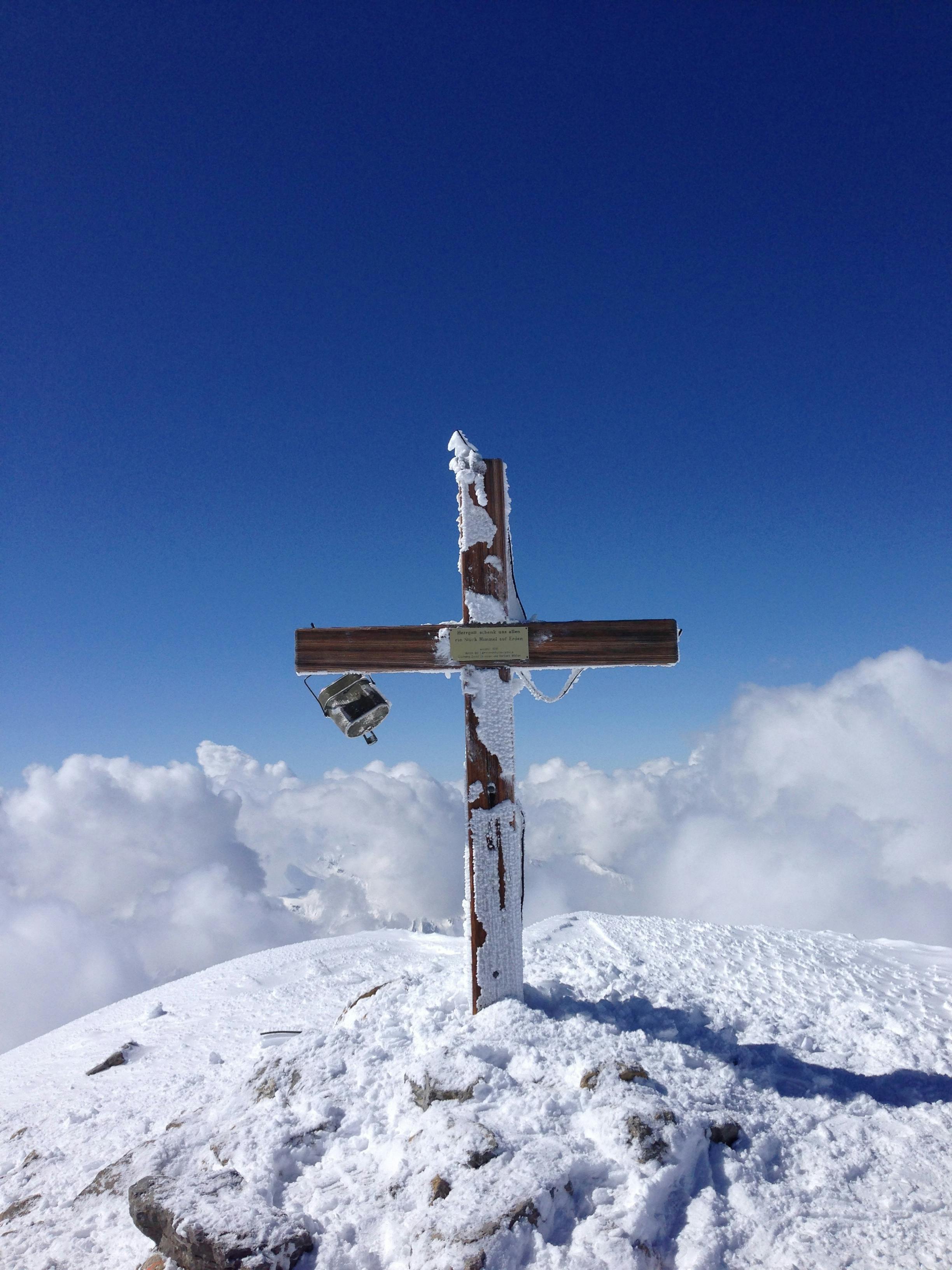 grave cross on snowy hilltop