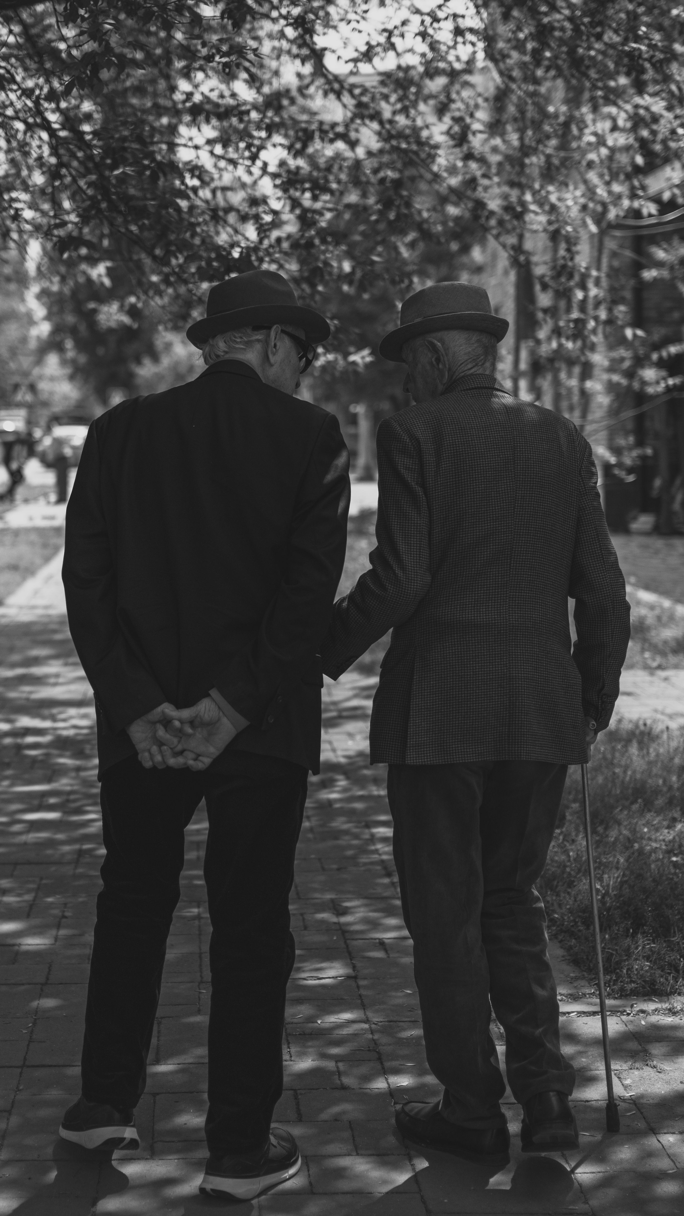 Two older adults walking together
