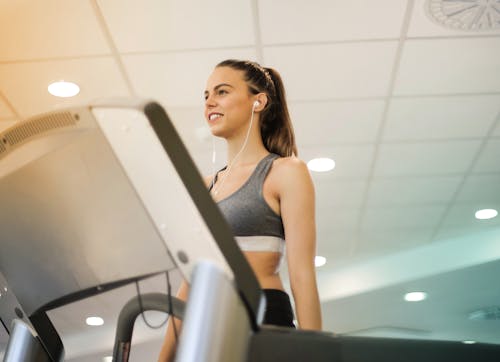 Free Photo Of Woman Using Earphones Stock Photo