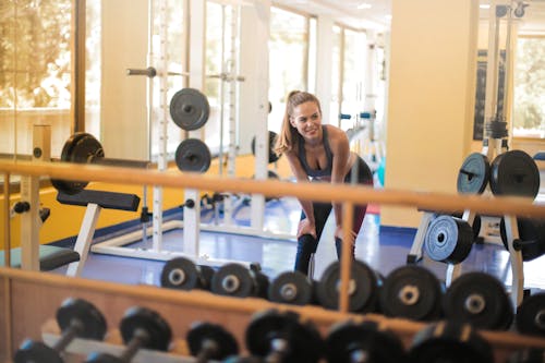 Photo Of Woman In Front Of Gym Equipment