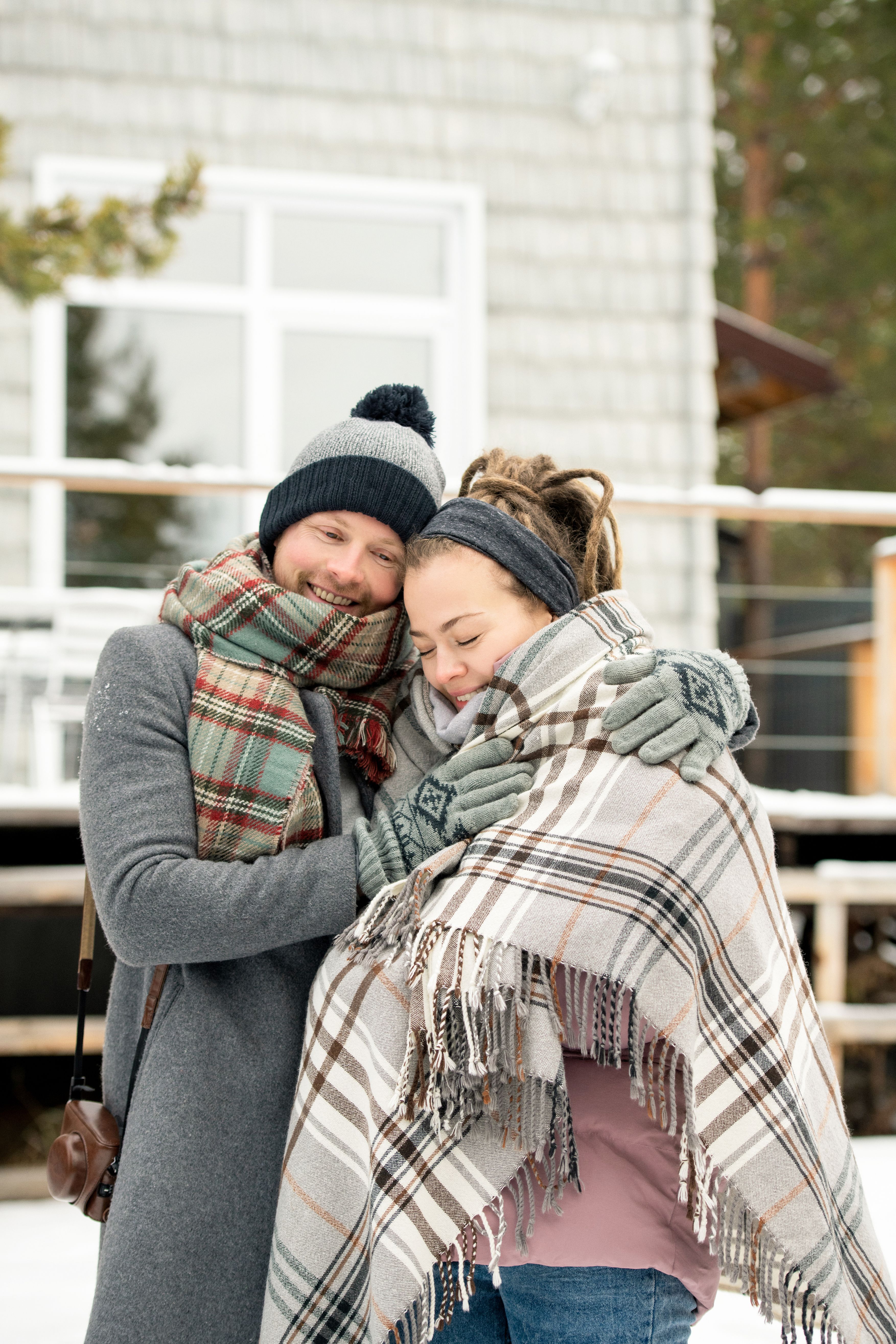 Man in gray coat beside a woman free stock photo