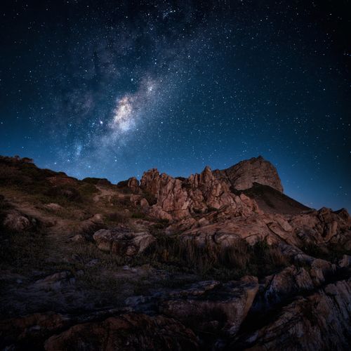 Free Stunning view of the Milky Way over rocky landscape in Pringle Bay, South Africa. Stock Photo