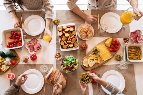 Free A top view of a diverse spread of food and drinks set for a family lunch. Stock Photo