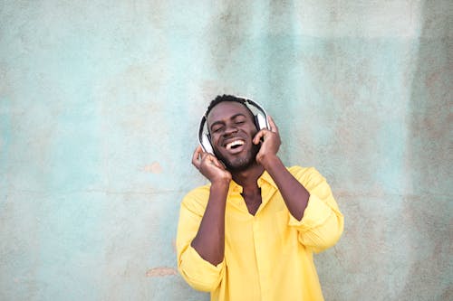 Free Photo Of Man Using Headphones Stock Photo