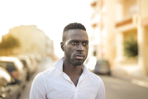 Serious Man in White Button Shirt