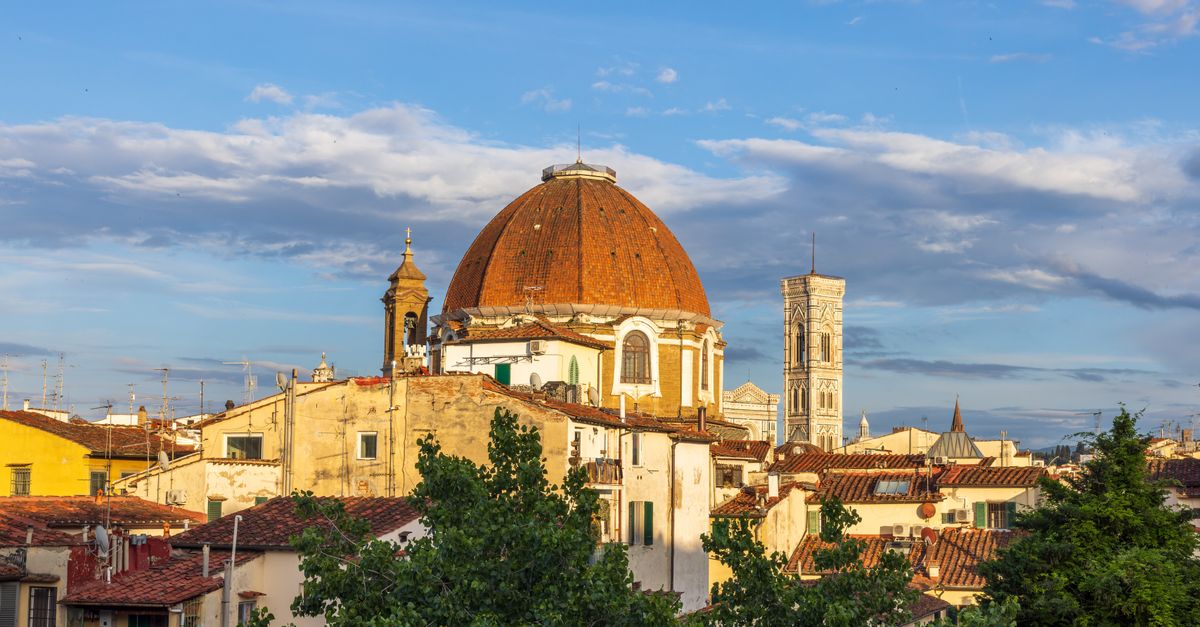 The dome of Florence cathedral above the terracotta rooftops of the old city