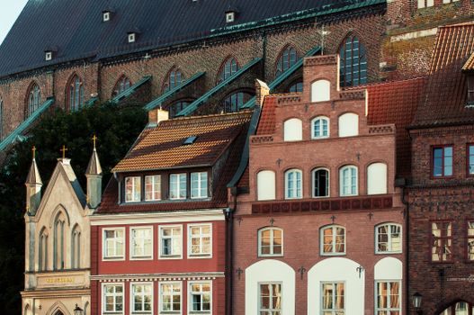 Charming scene of historic European architecture with colorful brick facades in an urban setting.