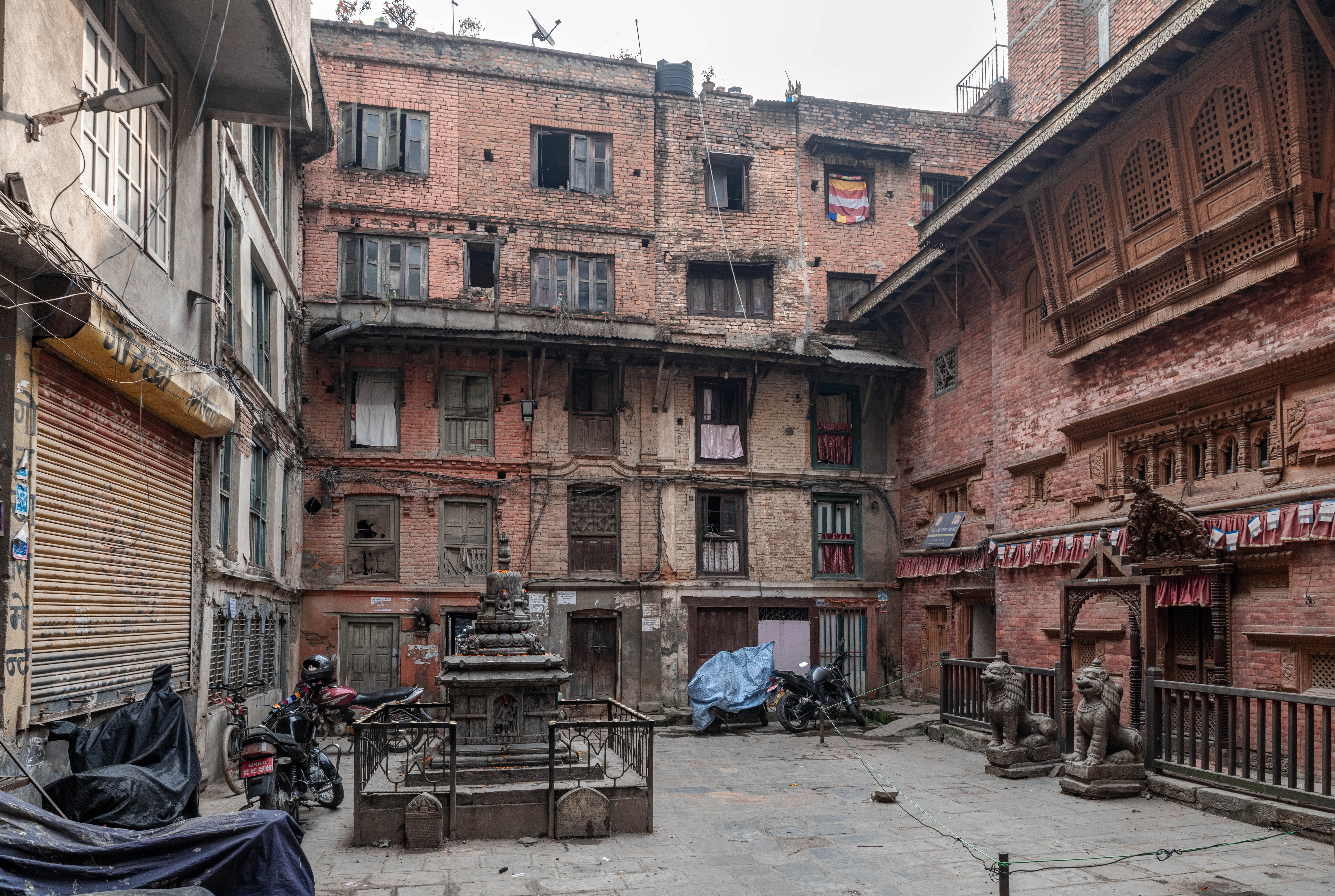 Ancient brick courtyard with traditional architecture in Kathmandu, Nepal.