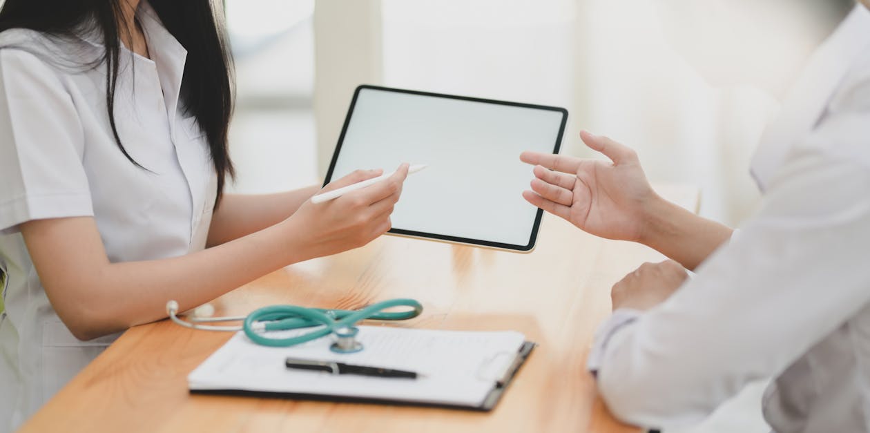 Teal Stethoscope On Wooden Table