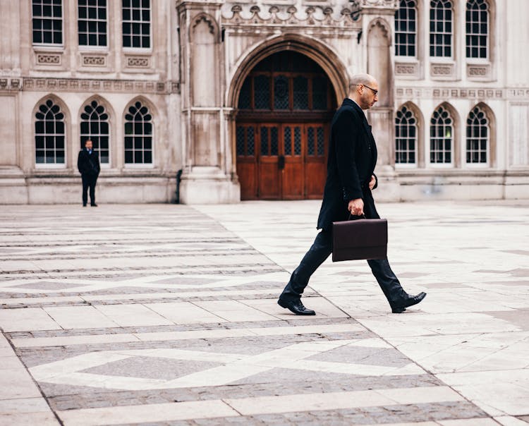 Man Walking Near House