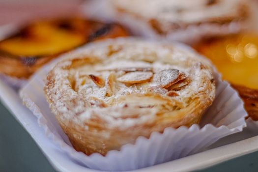 Scrumptious almond puff pastry with powdered sugar, perfect for dessert lovers.