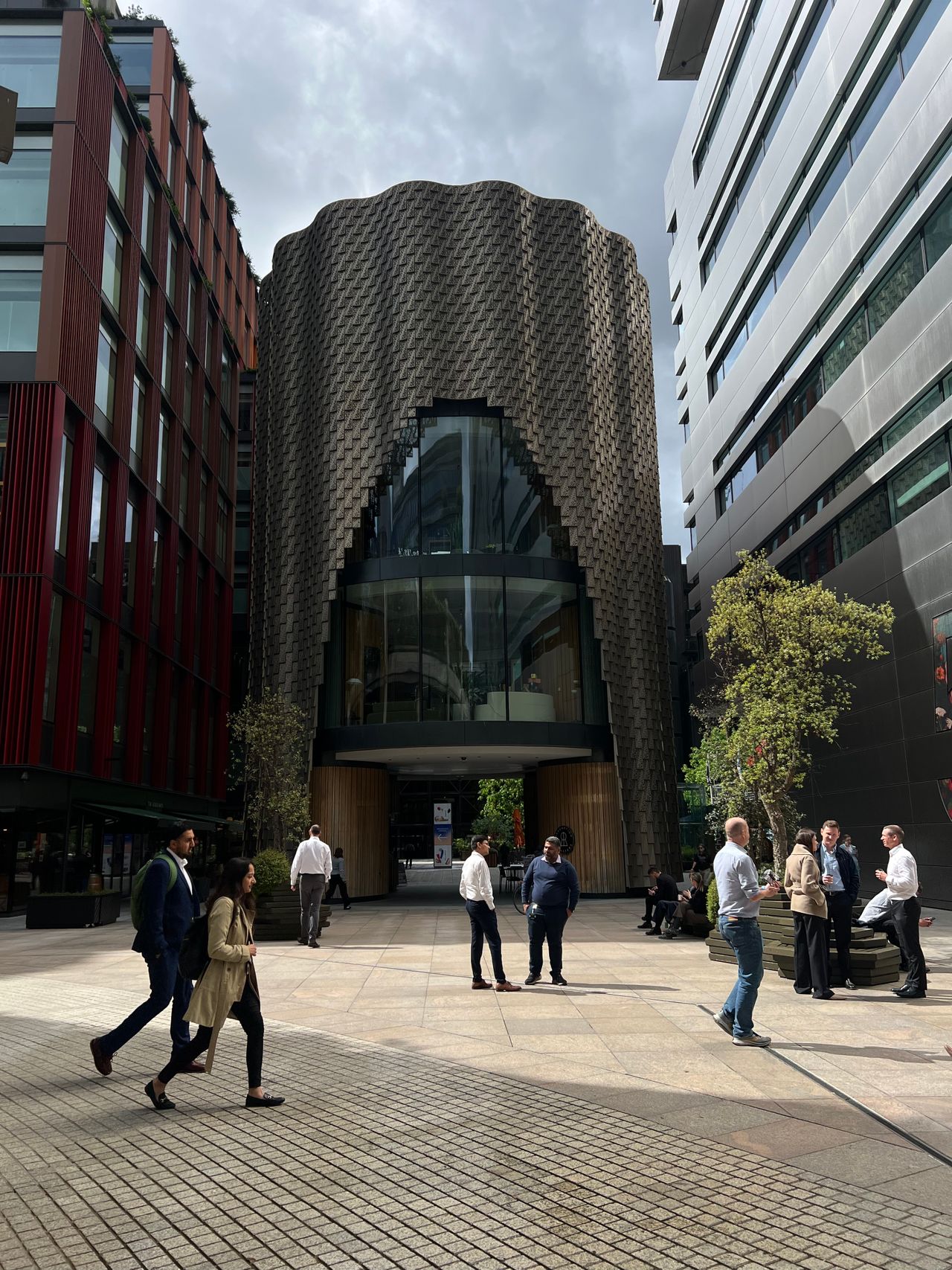 People outside contemporary office buildings in central London