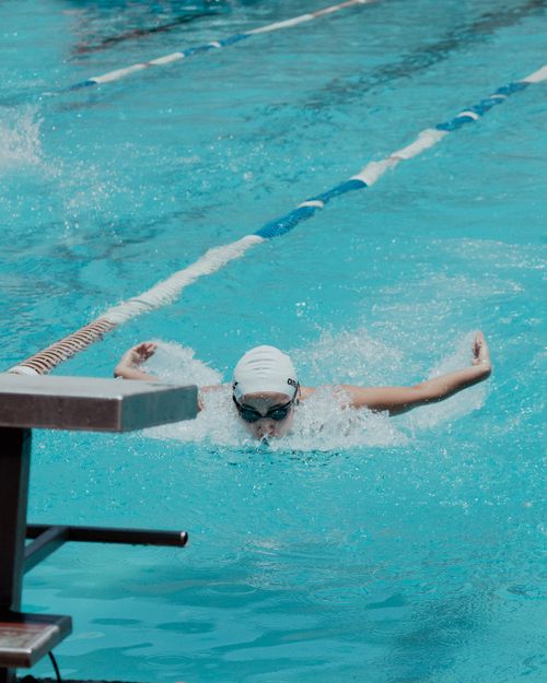 Free A focused swimmer performs the butterfly stroke in an outdoor swimming pool race, San Miguel de Allende. Stock Photo