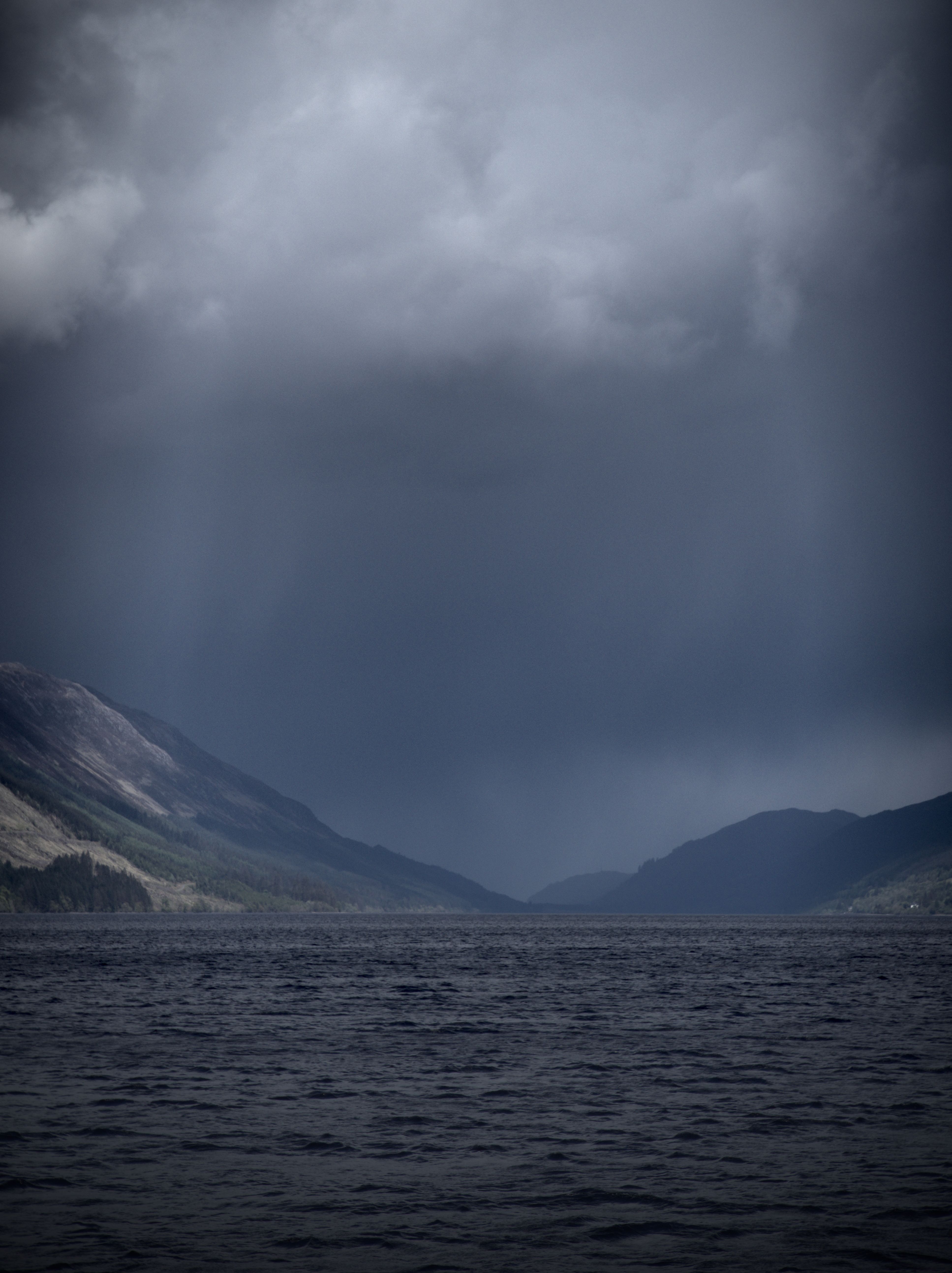 Dramatic Storm Clouds Over Scottish Loch · Free Stock Photo