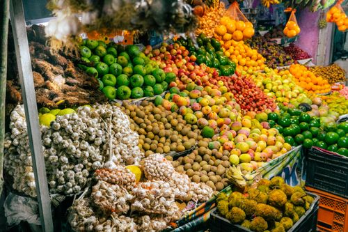 Free A colorful display of fruits and vegetables at an outdoor market in Kodaikanal, India. Stock Photo