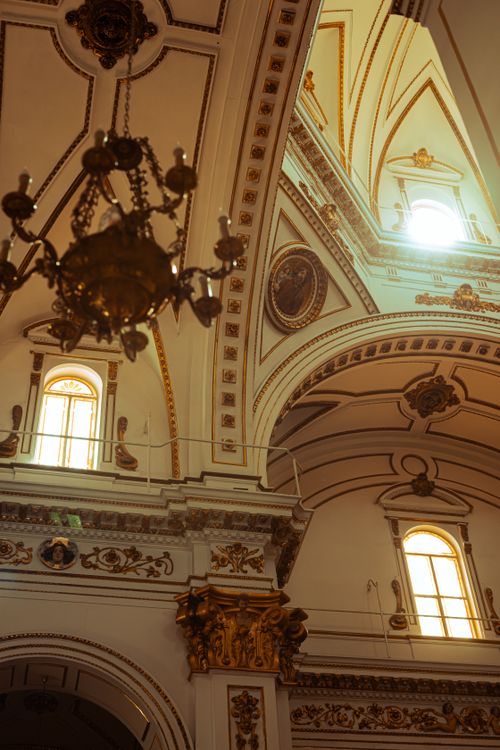 Free Captivating view of ornate Baroque church interior in Altea, Spain, featuring detailed architecture and sunlight effect. Stock Photo