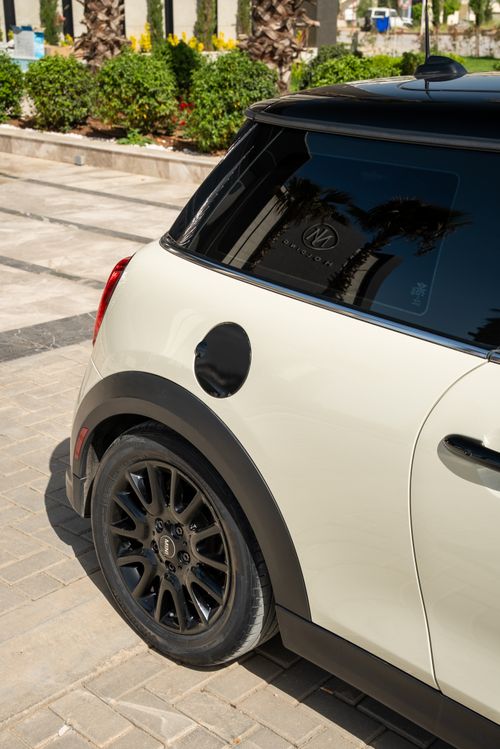 Free Close-up of a white car with black rims parked outdoors in Sulaymaniyah, Iraq. Stock Photo