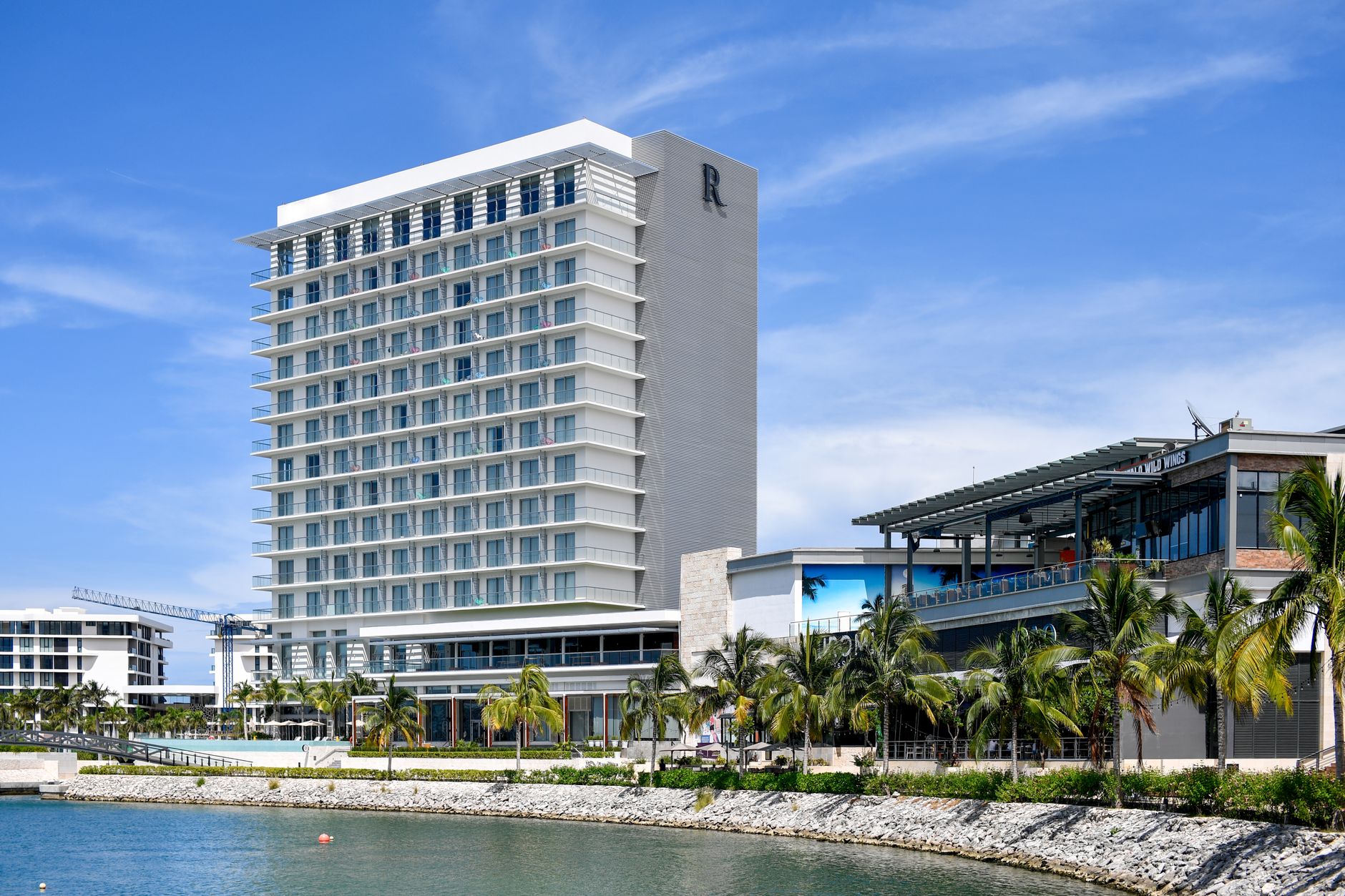 Modern luxury hotel located on the waterfront of Cancún, Mexico, perfect for tropical vacations.